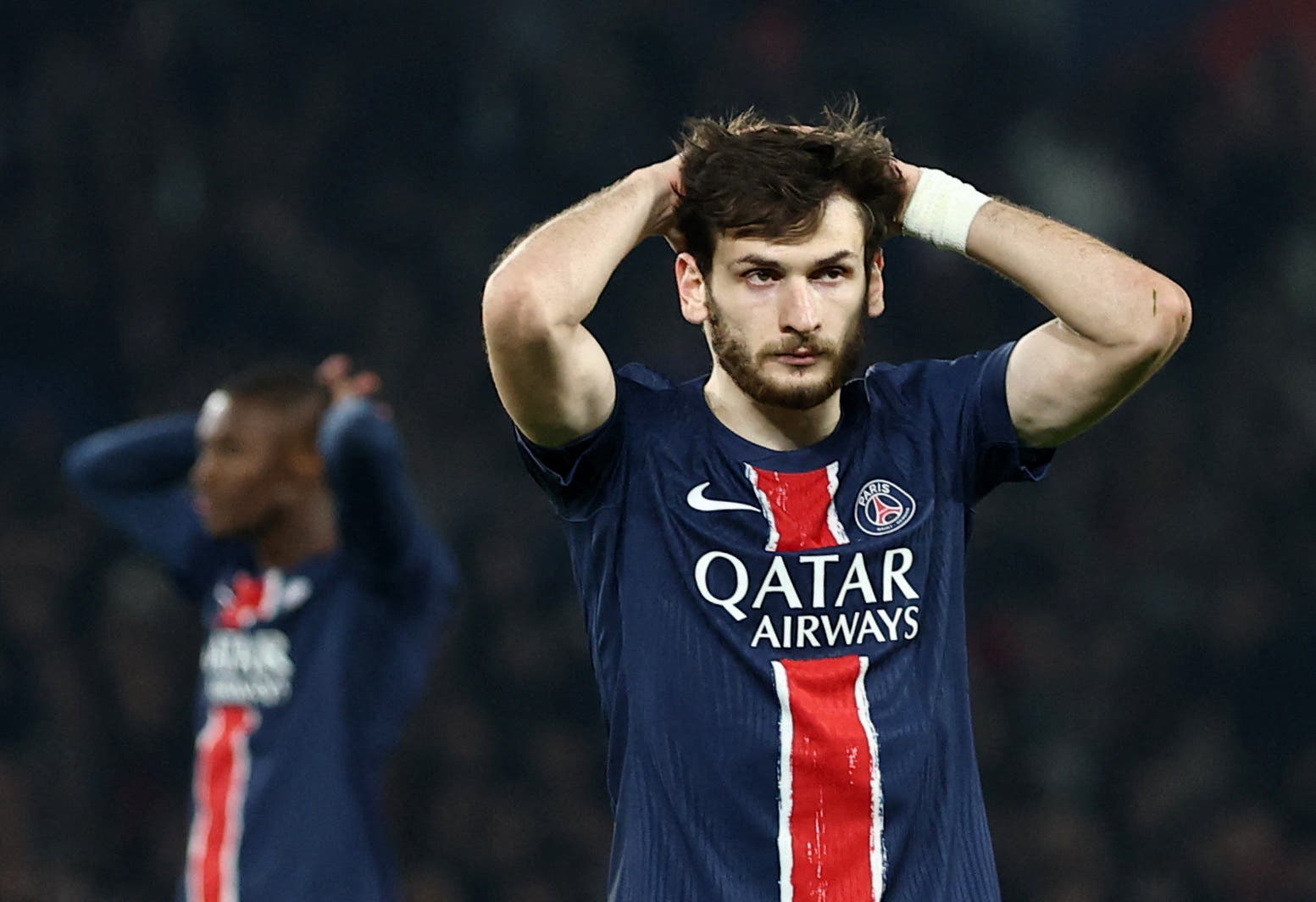 Paris St Germain's Khvicha Kvaratskhelia reacts after missing a chance to score