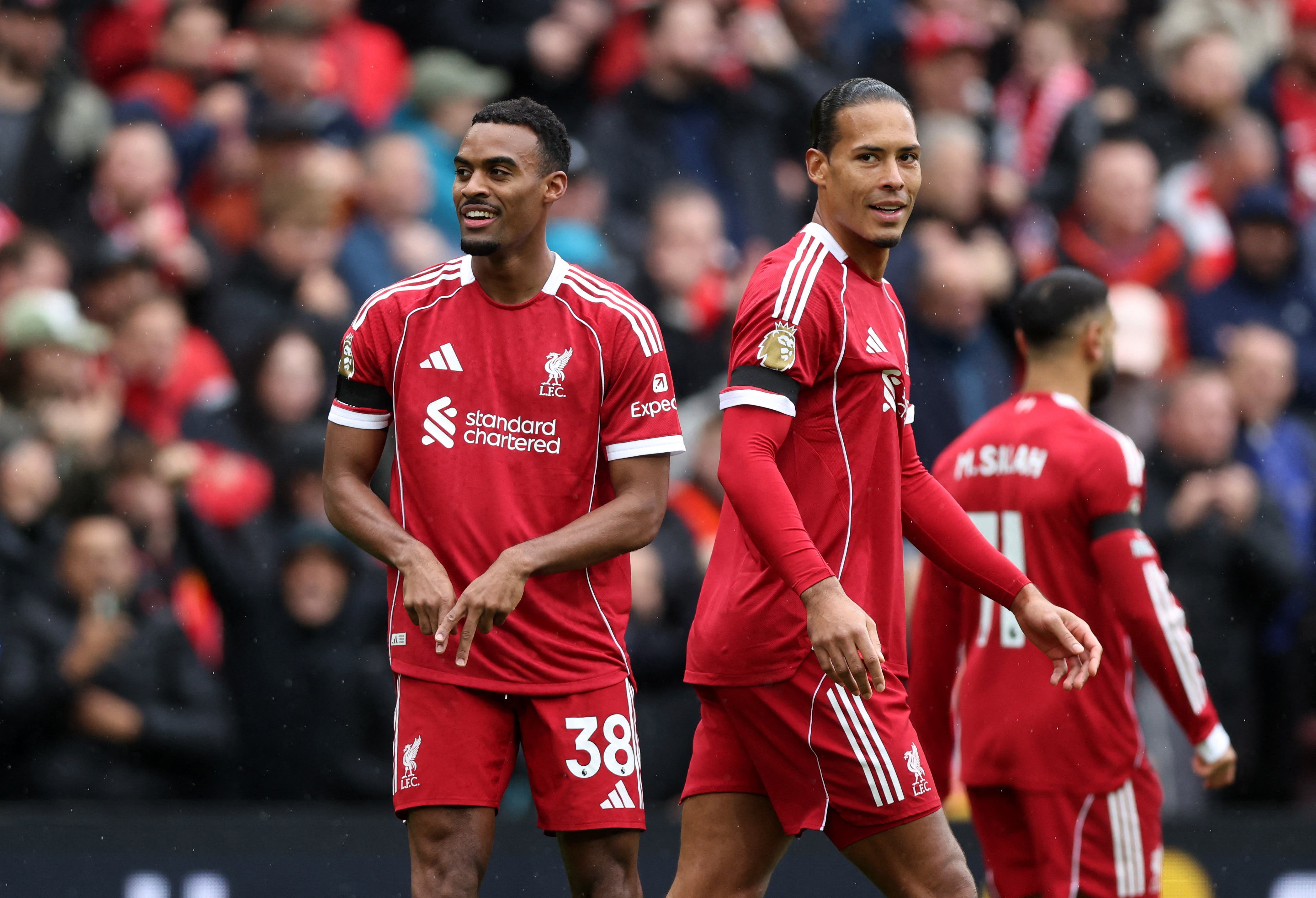 Soccer Football - Premier League - Liverpool v Everton - Anfield, Liverpool, Britain - September 20, 2025 Liverpool's Ryan Gravenberch celebrates scoring their first goal with Liverpool's Virgil van Dijk REUTERS/David Klein