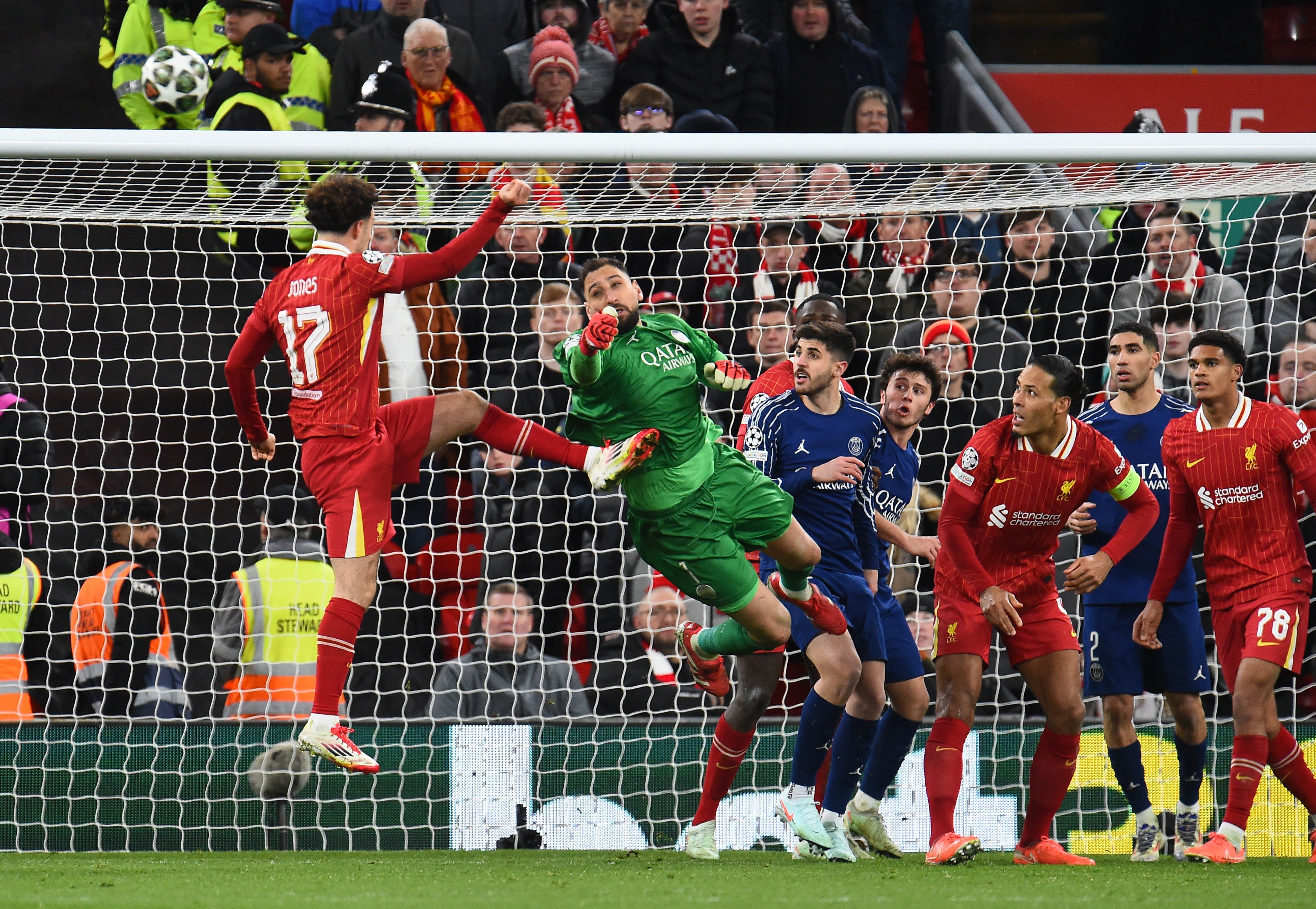 Liverpool's Curtis Jones in action with Paris St Germain's Gianluigi Donnarumma