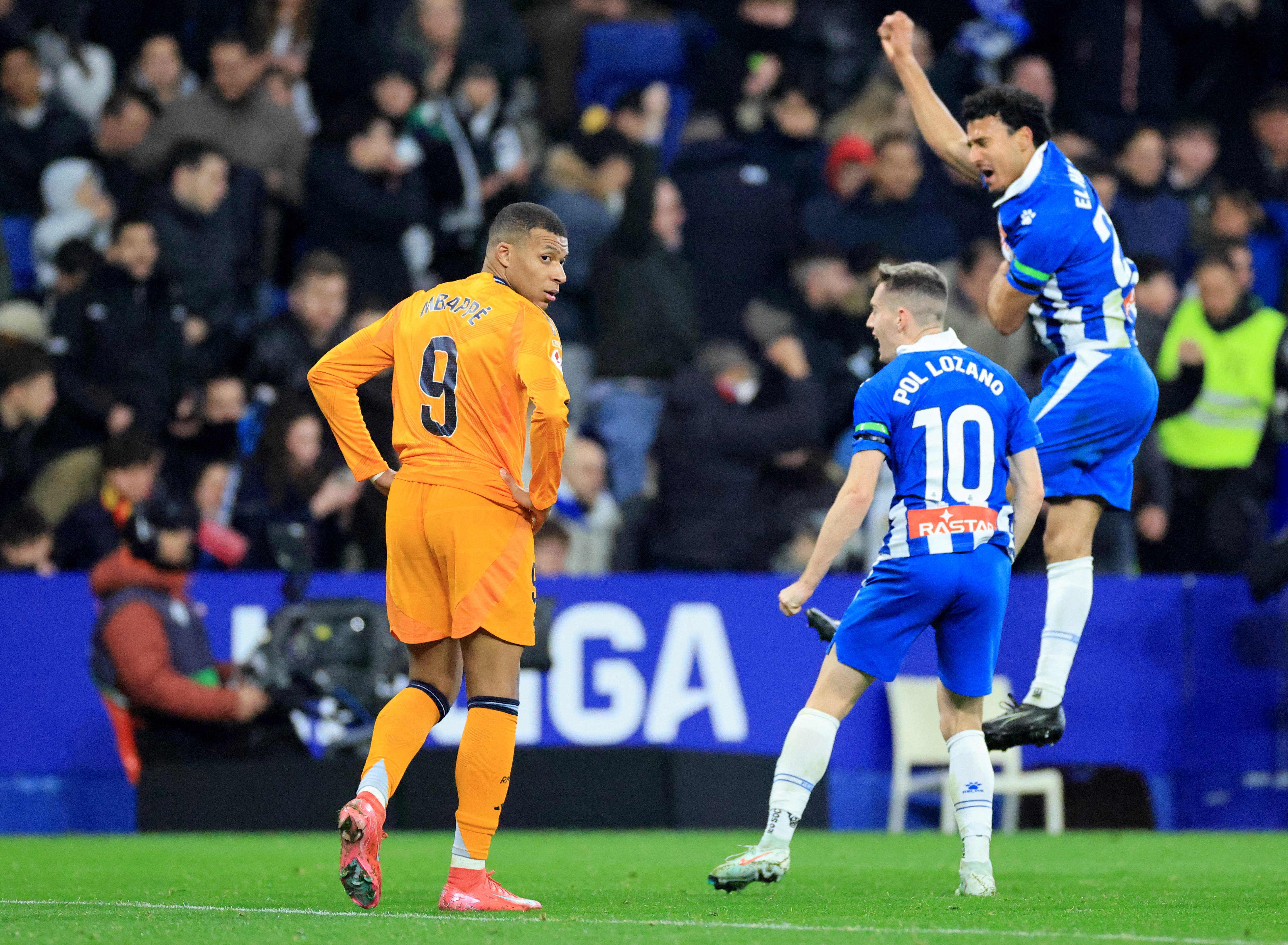 Espanyol celebrates while Mbappe look away after defeat