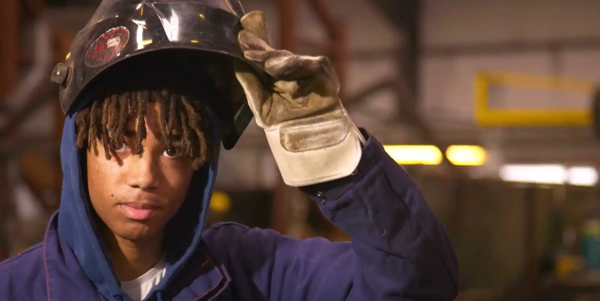 T Level student in a factory wearing protective gear