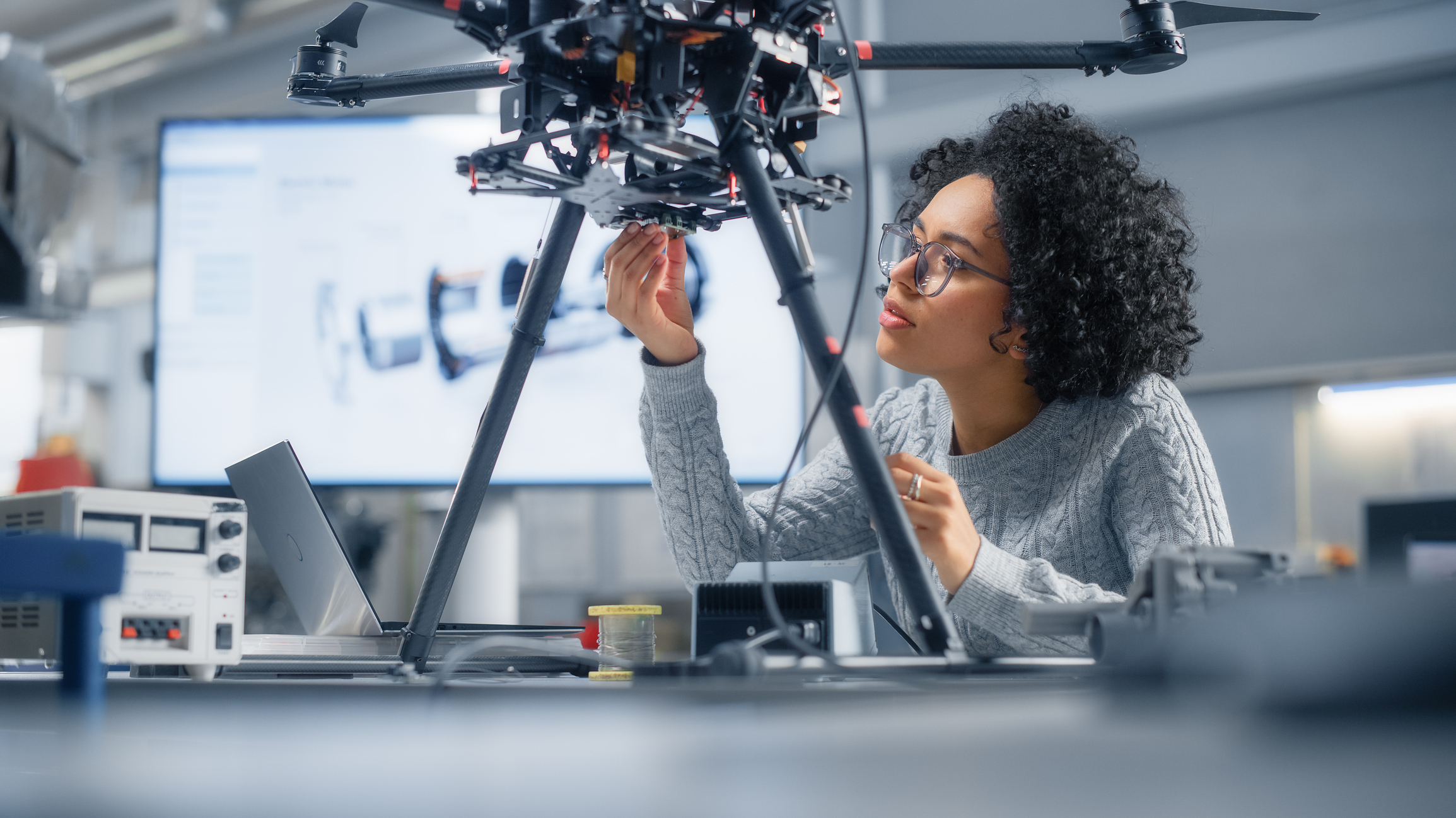 Women working on an engineering project.
