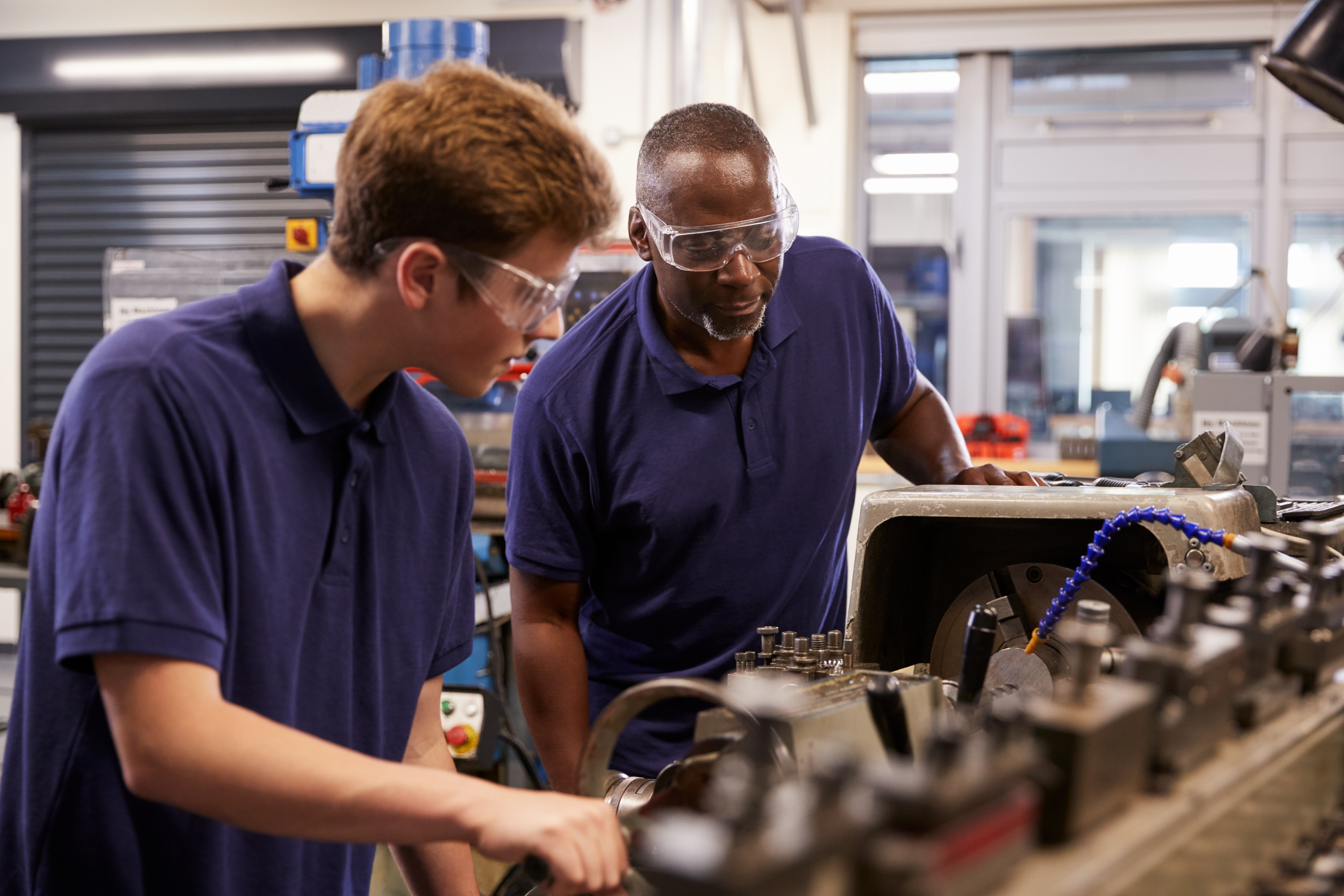 Apprenticeship Research blog image of an apprentice and a member of staff working together.