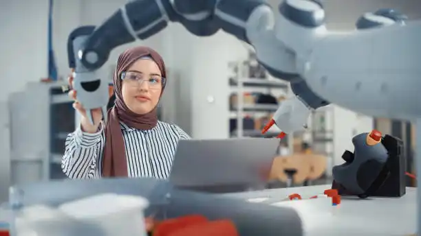 Engineer using robotic tool.