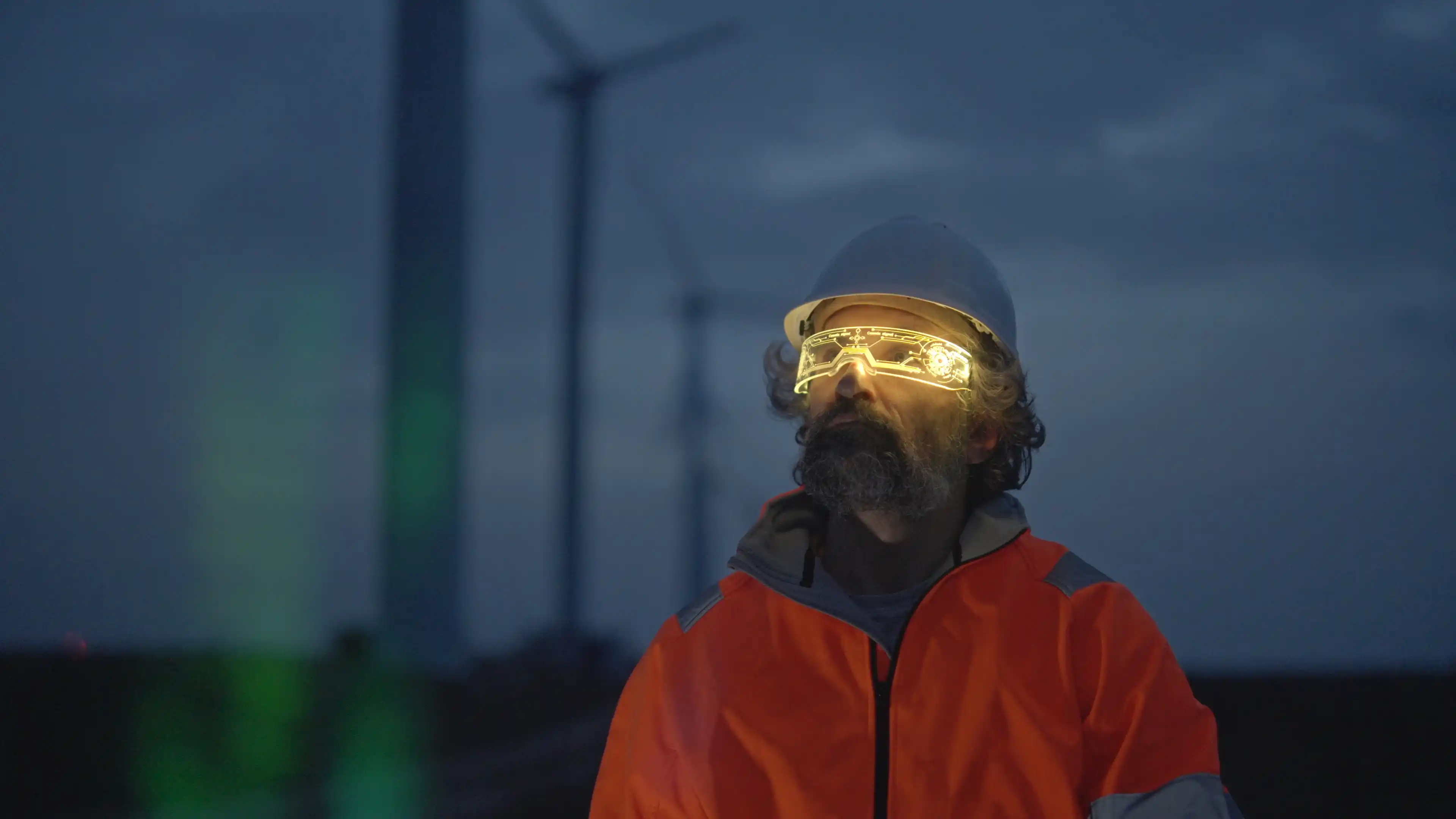 Person wearing hard hat and augmented reality headset