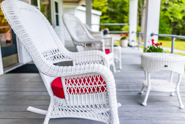 wicker rocking chairs on a porch