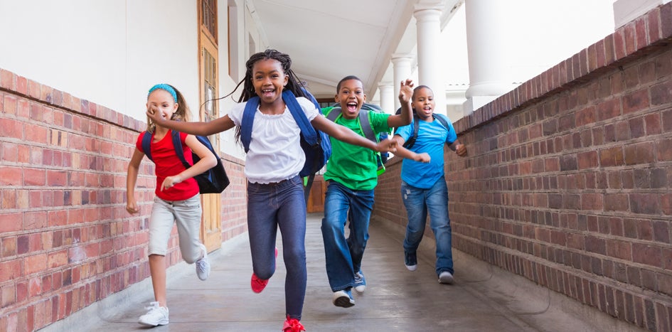 Children running in school hallyway