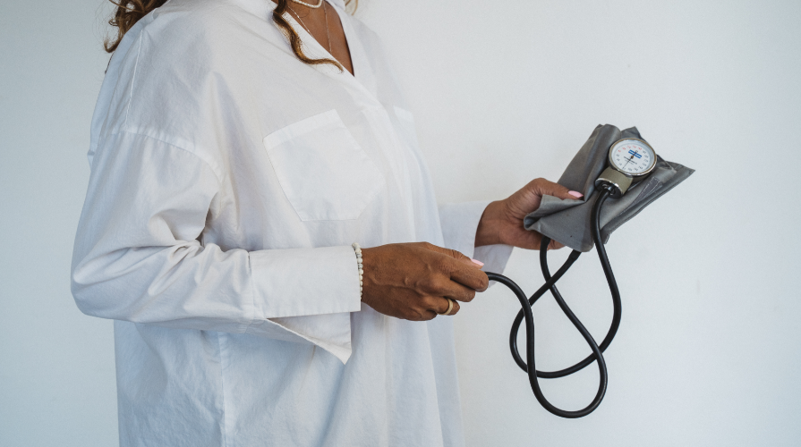 A school nurse holding a blood pressure cuff.