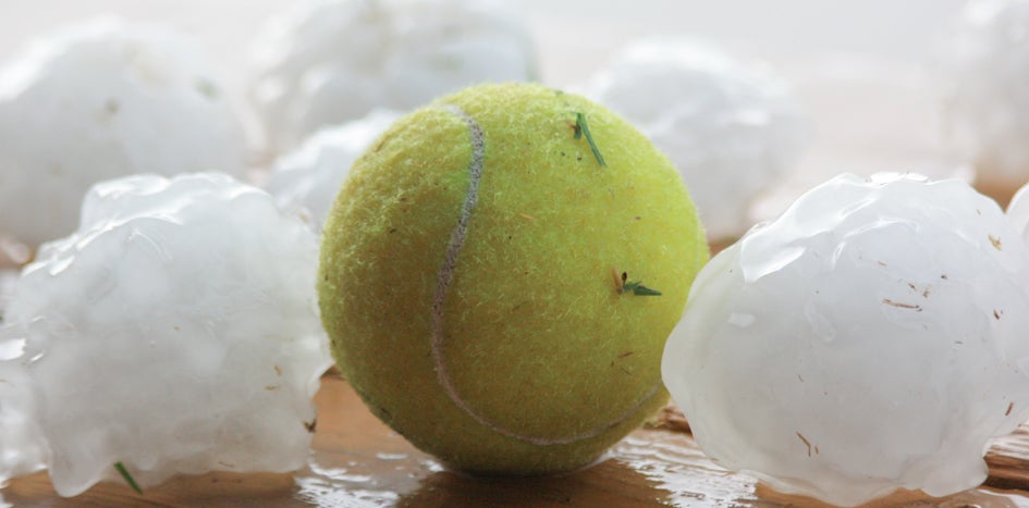 Hail next to tennis ball
