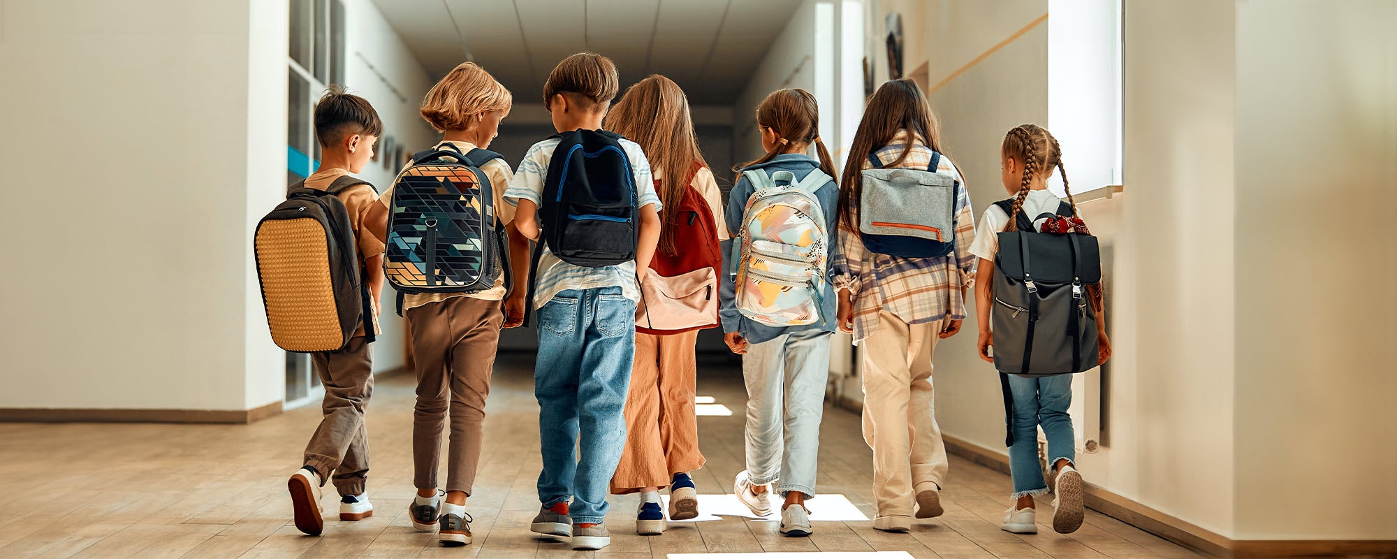 Children walking in a school hallway 