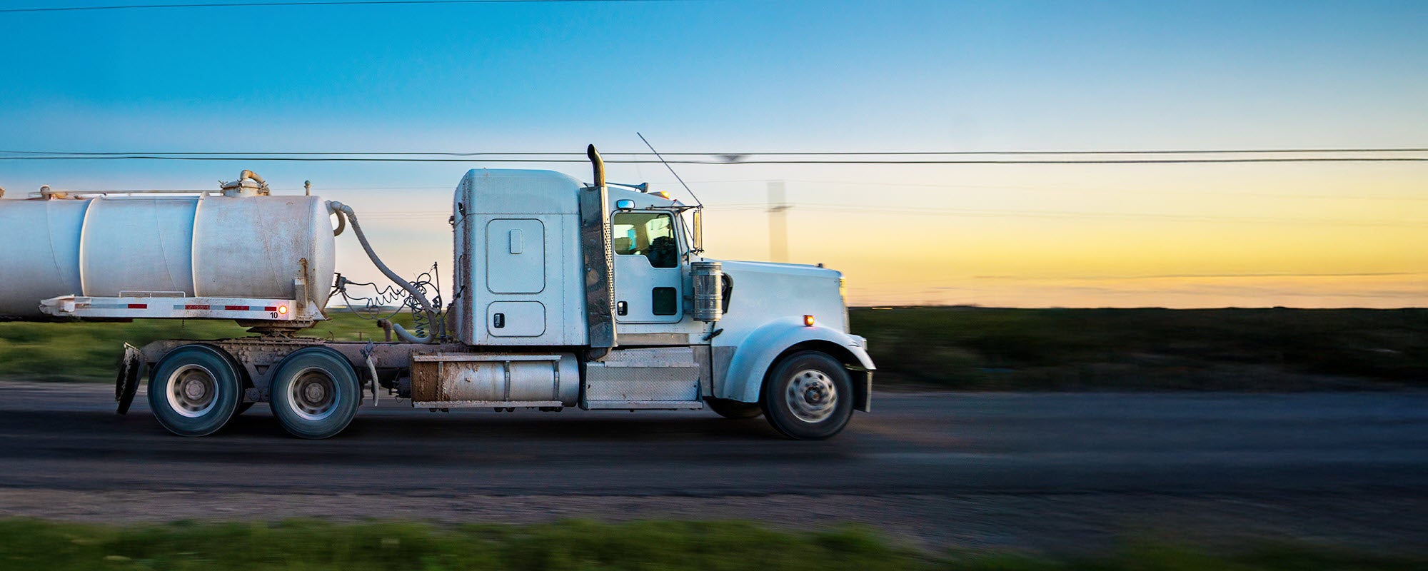 White semi truck transporting propane.