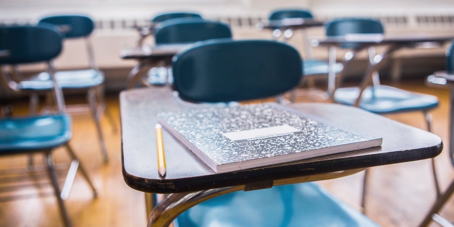 Pencil and notebook on a desk