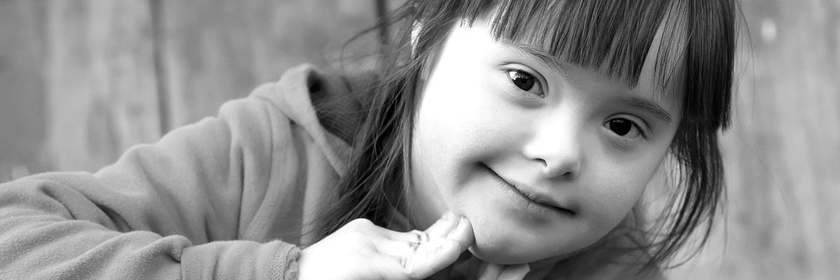 Black and white photo of a young girl student with special needs