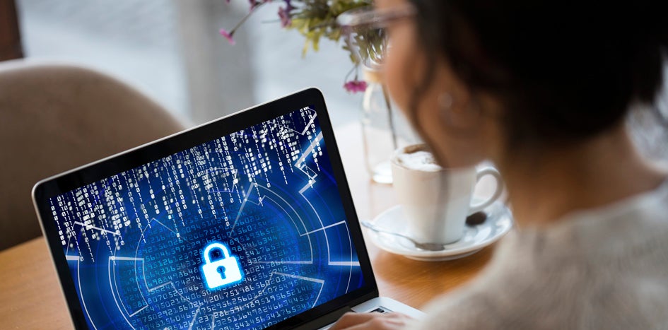 Woman looking at laptop screen with lock image displayed