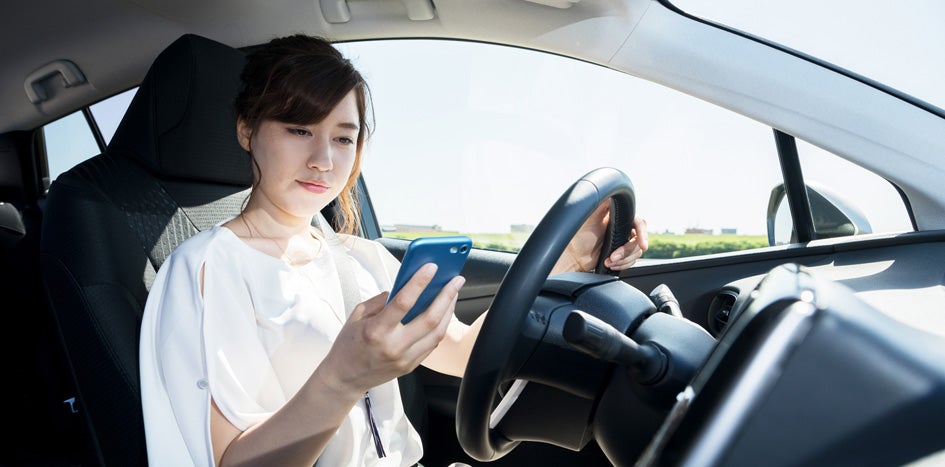 Distracted driver looking at cellphone