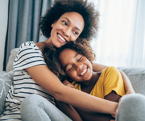 Mother and daughter hugging 