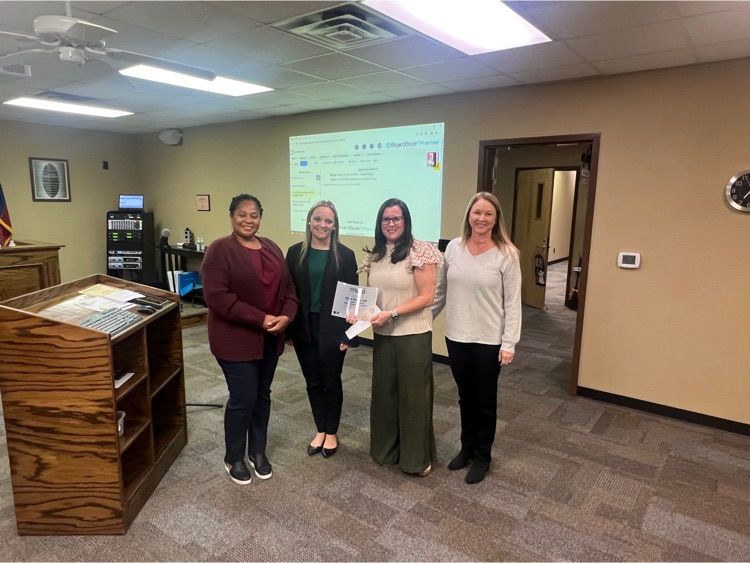 TASB Senior Marketing Consultant Jennifer Jones (left) presents a Fund Excellence Award to Blue Ridge ISD Chief Financial Officer Amanda Ray, Coordinator of Special Education and Intervention Services Terra Mathers, and Payroll and Benefits Manager Keri Johnson