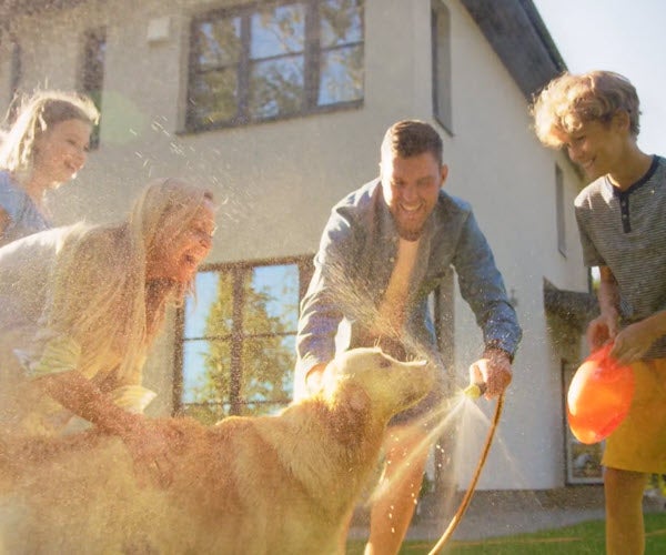 Family washing their dog