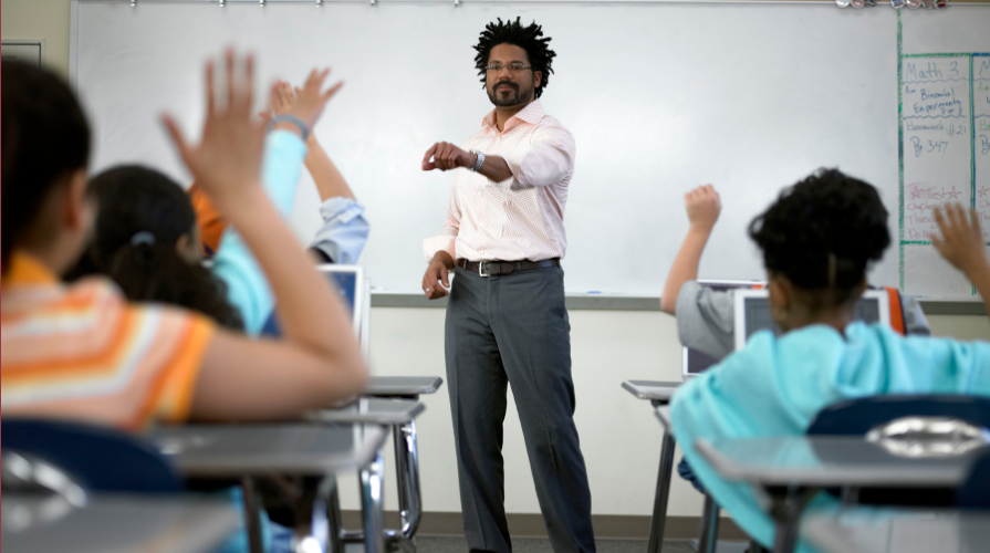 Teacher calling on student in active classroom 