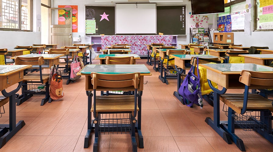 empty classroom with student desks 