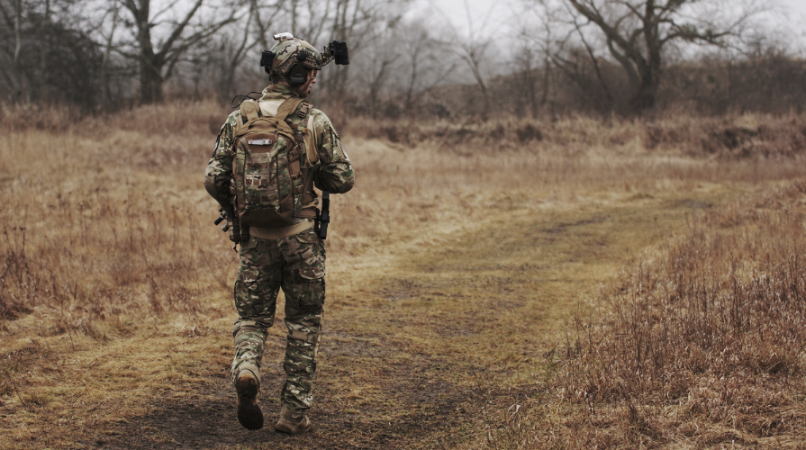 photo of a military soldier walking outside