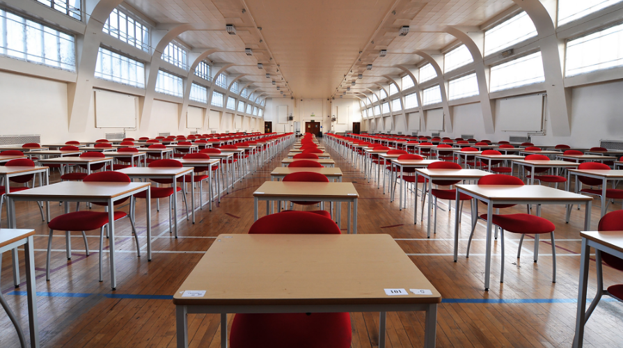 Rows of desks and red chairs
