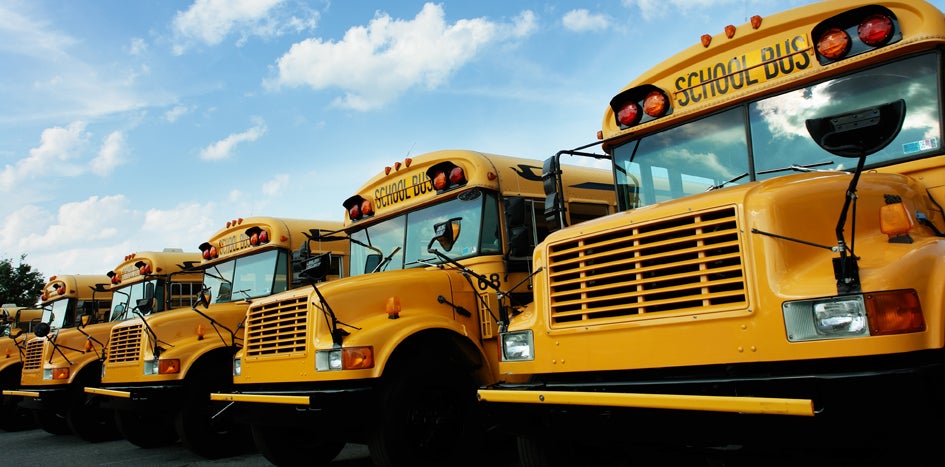 School buses and cloudy skies