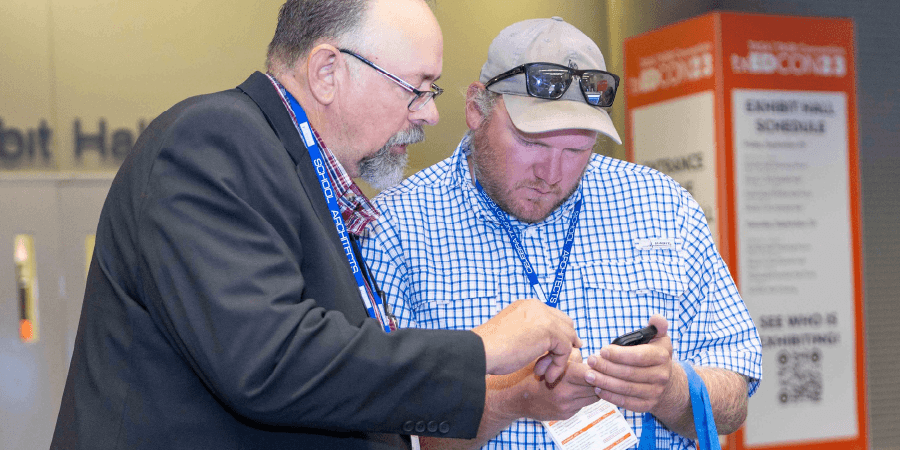 photo of txEDCON attendees holding a cell phone