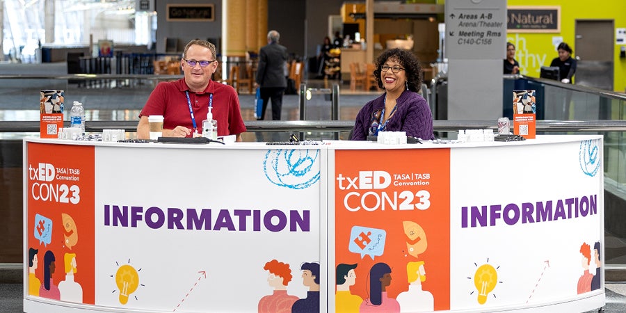 photo of staff at txEDCON23 info booth