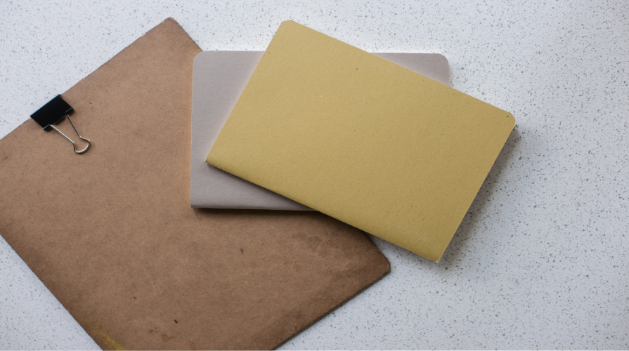 photo of file folders in brown, gray and yellow