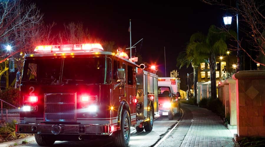 Fire truck and ambulance responding at night