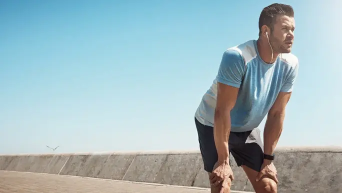 Man resting and catching his breath after exercise