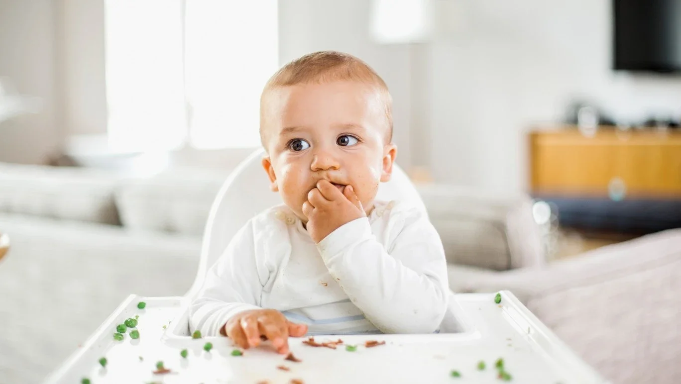 baby-trying-solid-foods-b.webp