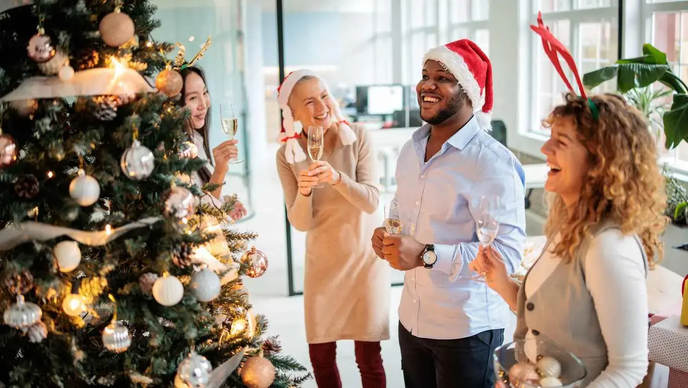Group of officer workers socialising at Christmas