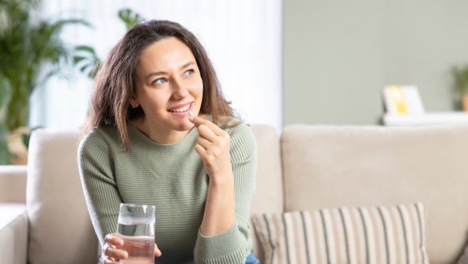 woman-taking-probiotic-pill.jpg