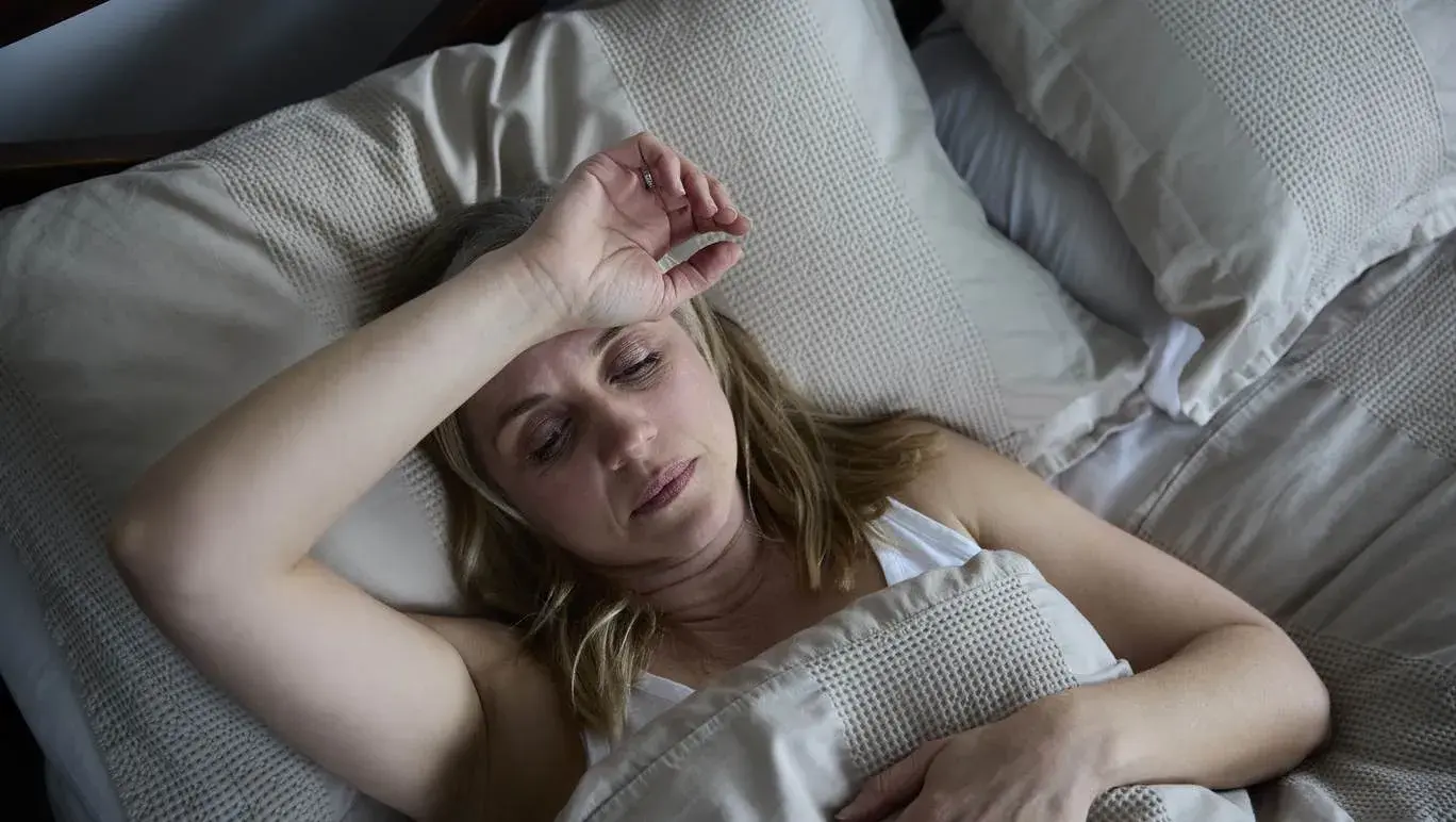 Women in bed with night sweats