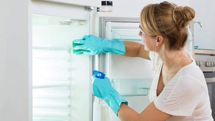 HEA - woman-cleaning-fridge.jpg