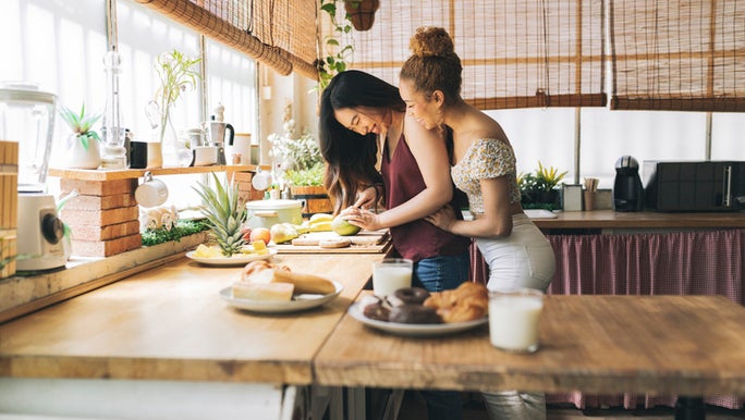 two-women-hugging-in-kitchen.jpg