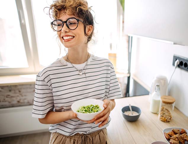 Woman at home eating a healthy breakfast