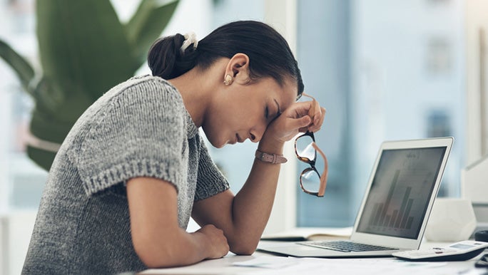 women-exhausted-at-desk.jpg