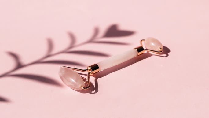 An image of a pink rose quartz face roller