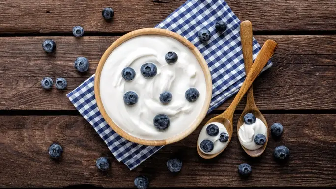 Bowl of yoghurt with fresh blueberries