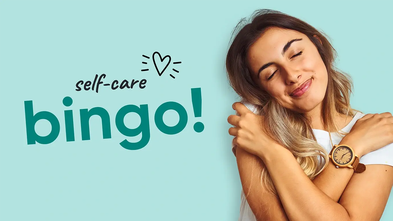 Young woman giving herself a warm hug