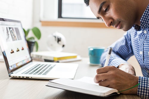 Man studying with a laptop