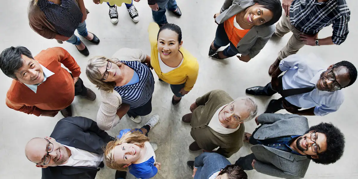 a group of people of different races looking up