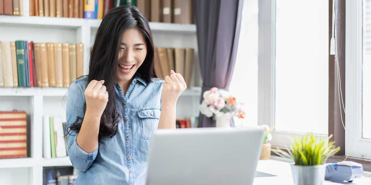 woman looking at a laptop?auto=format&q=75