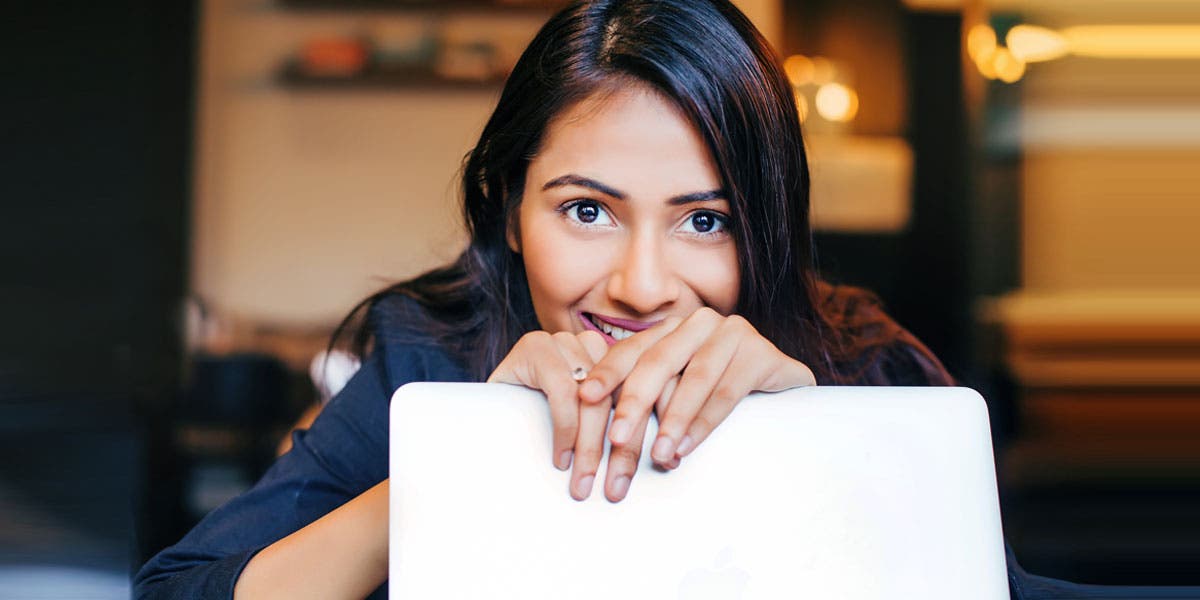 woman leader looking over her laptop