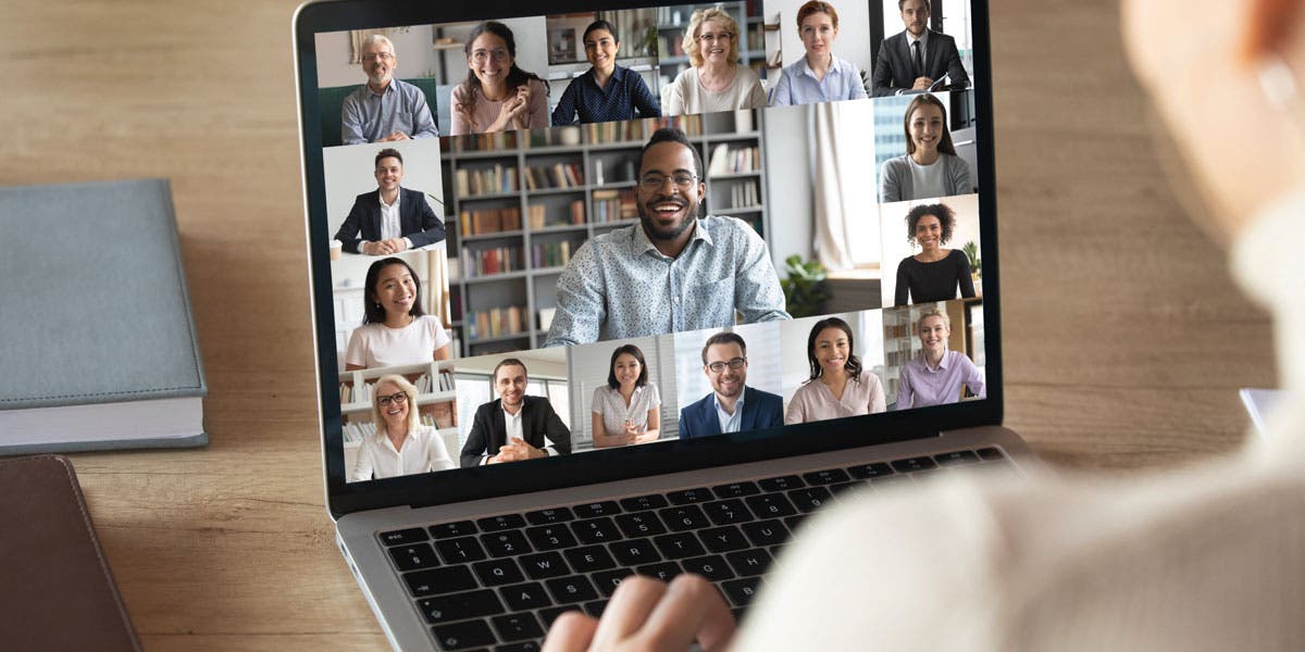 Laptop screen with multiple screens of smiling faces