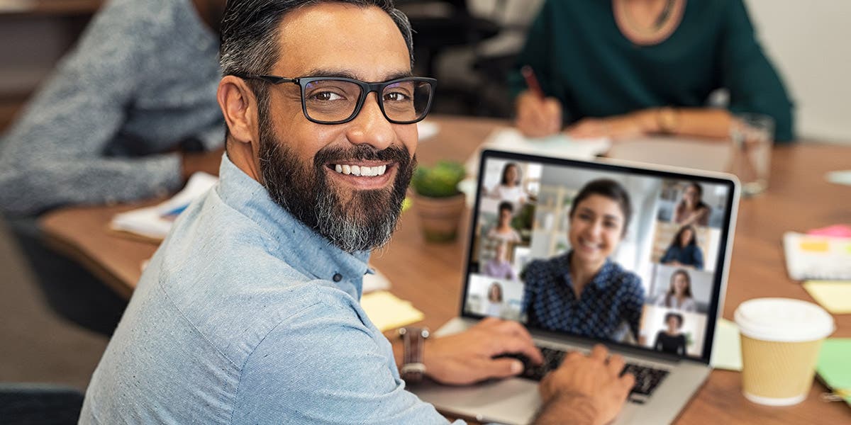 man having a virtual meeting on his laptop