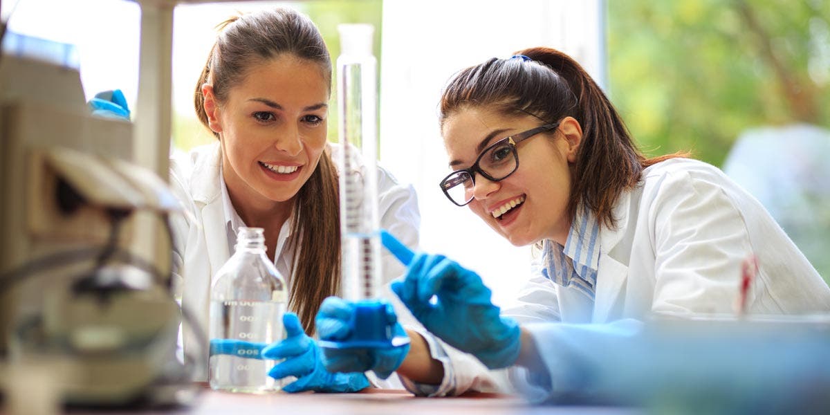 Two women scientists working together in a chemistry lab